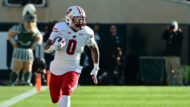 Wisconsin running back Braelon Allen running with the football in the open field.